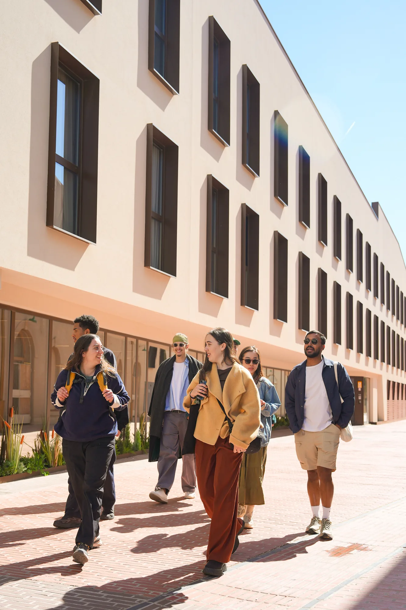 Students walking along the Blau campus in Poblenou on a sunny morning