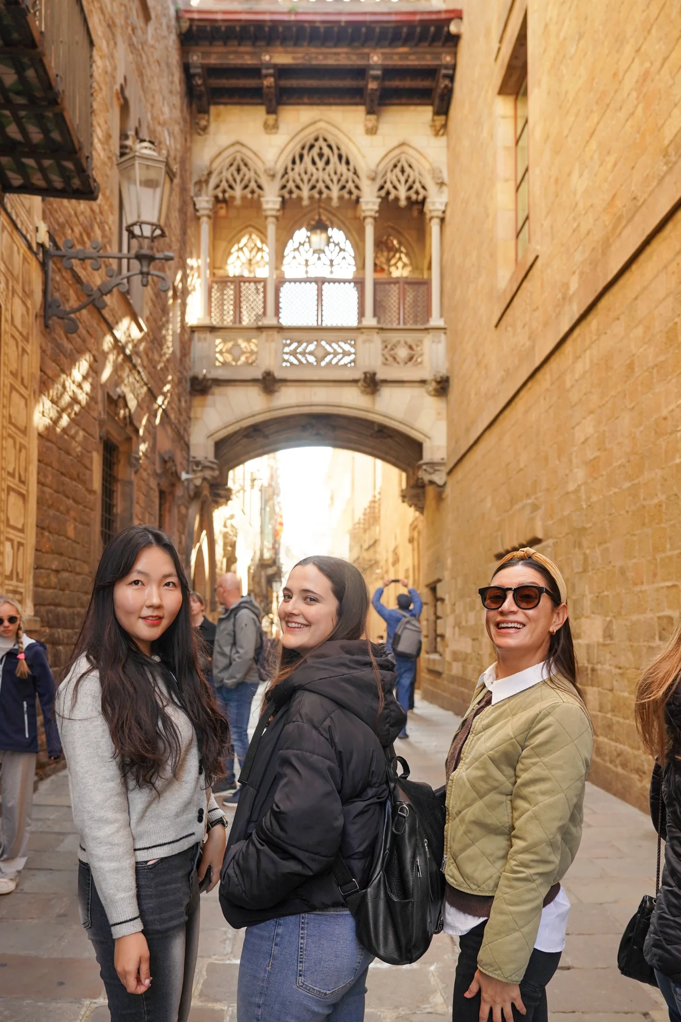 Students under the bridge of Carrer del Bisbe