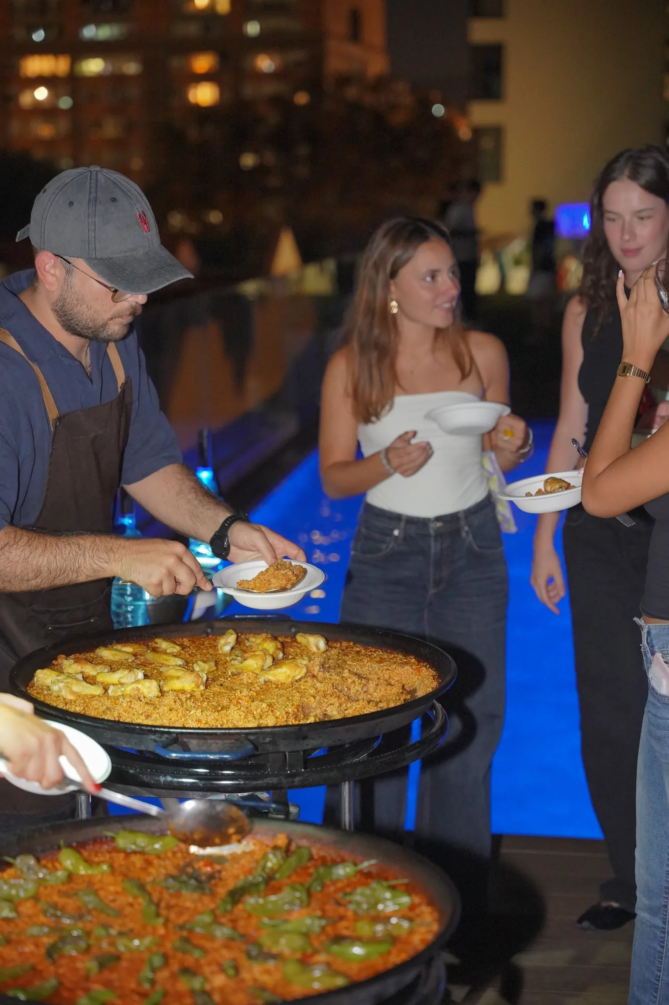 Paella being served on the rooftop