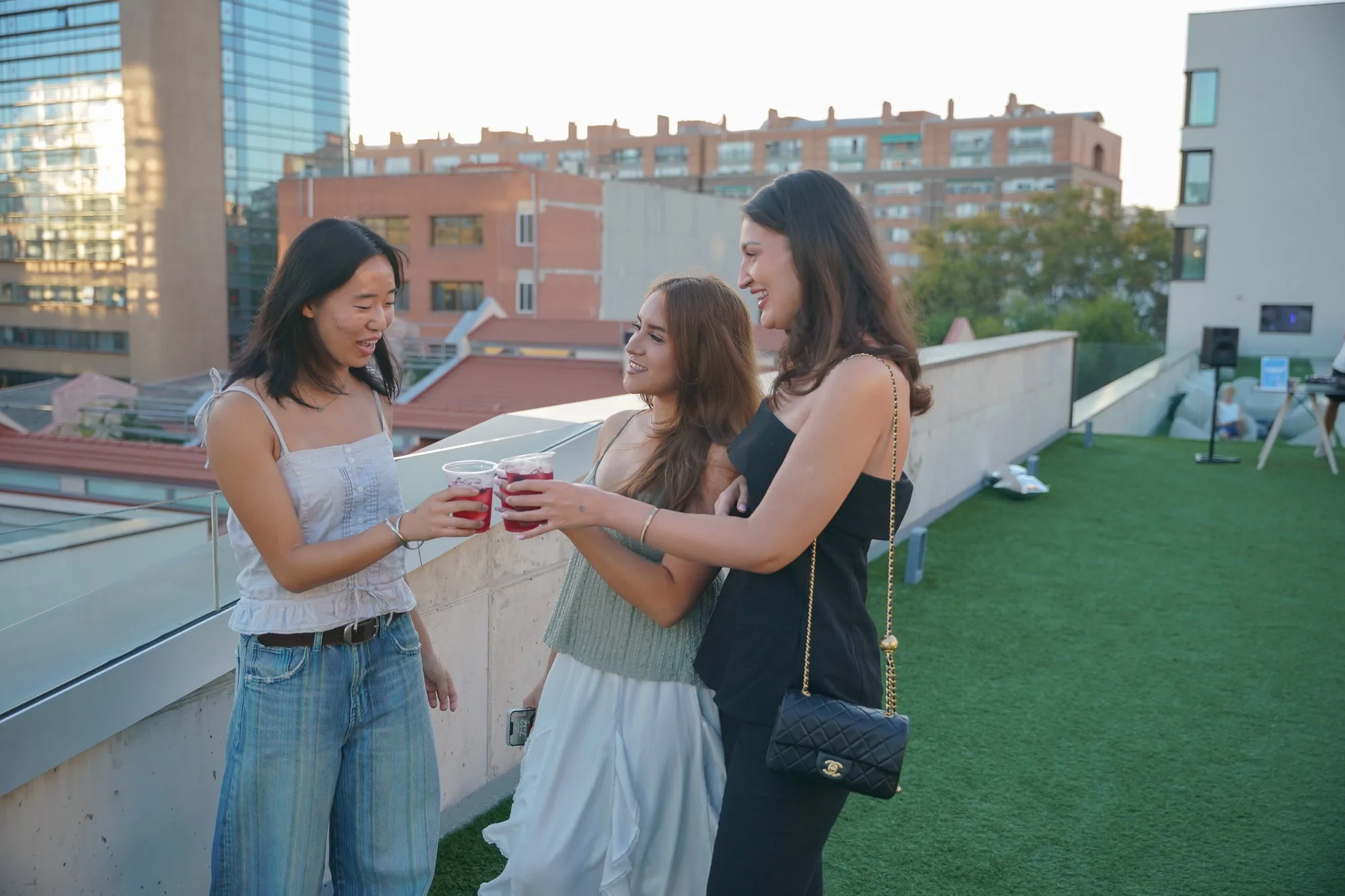 Students toasting at the rooftop welcome party